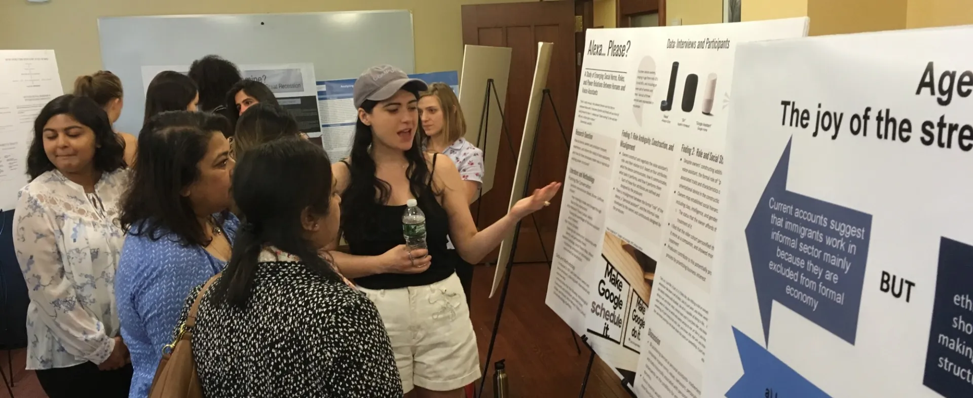 Masters students presenting research