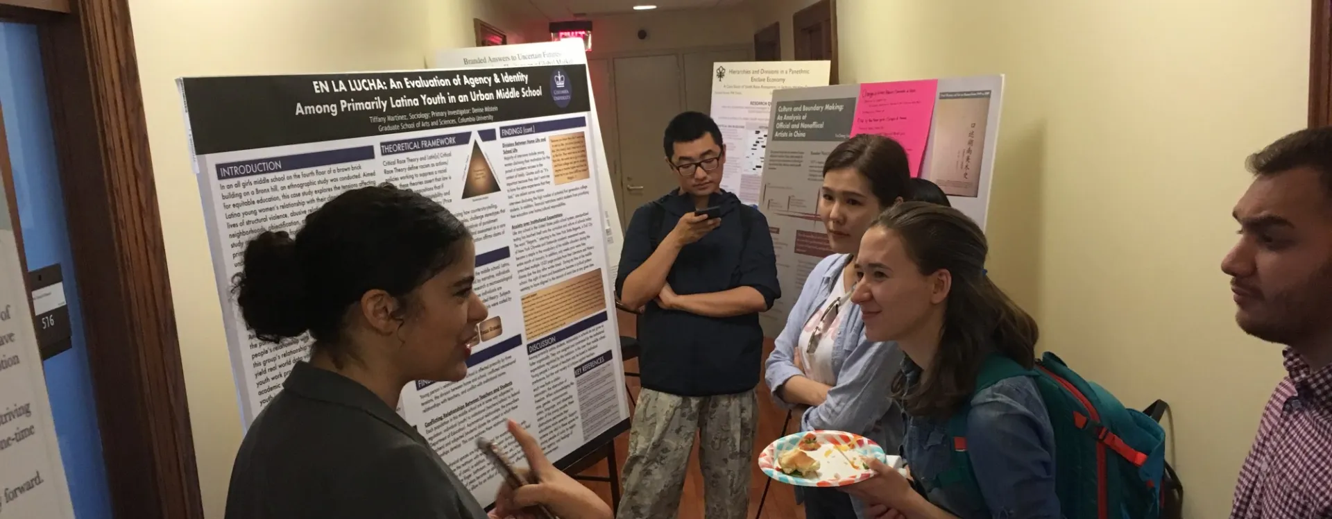 Students in hallway presenting work